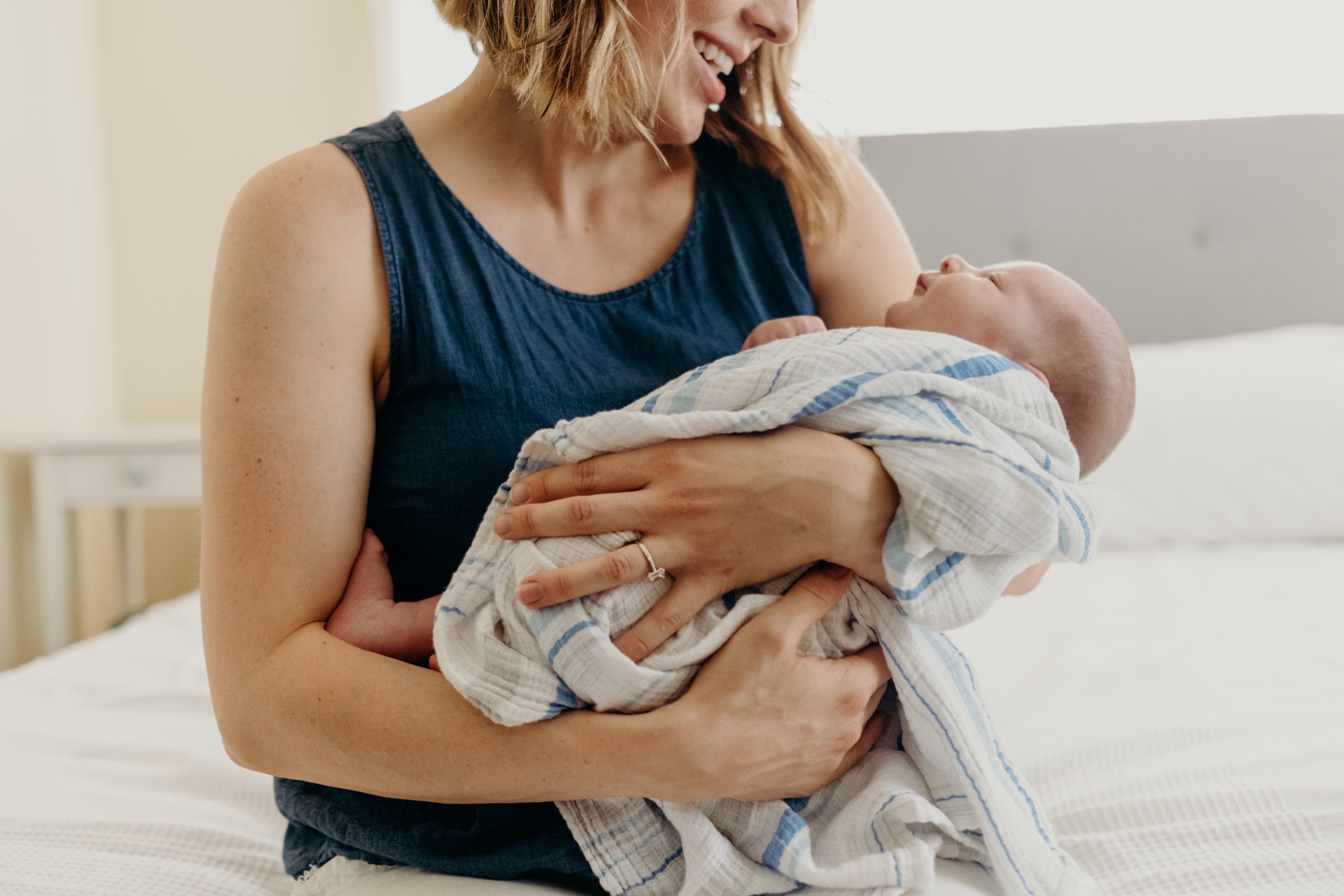 A mother cradling her newborn
